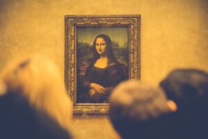 The Mona Lisa hangs on a wall at the Louvre