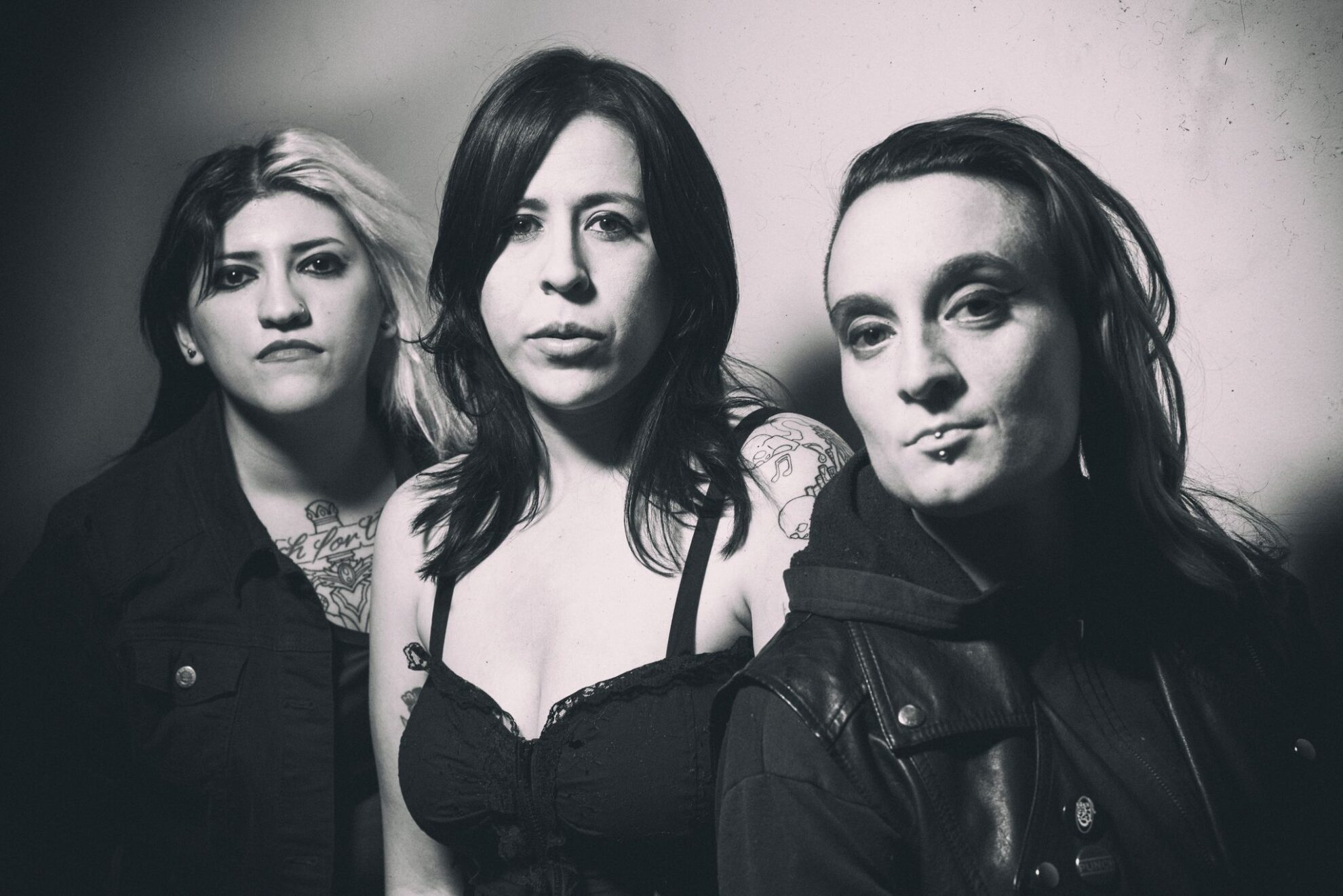 Black and white photo of the rock band The Venomous Pinks