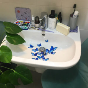 Sink decorated with blue watercolor butterflies by Marta Grossi
