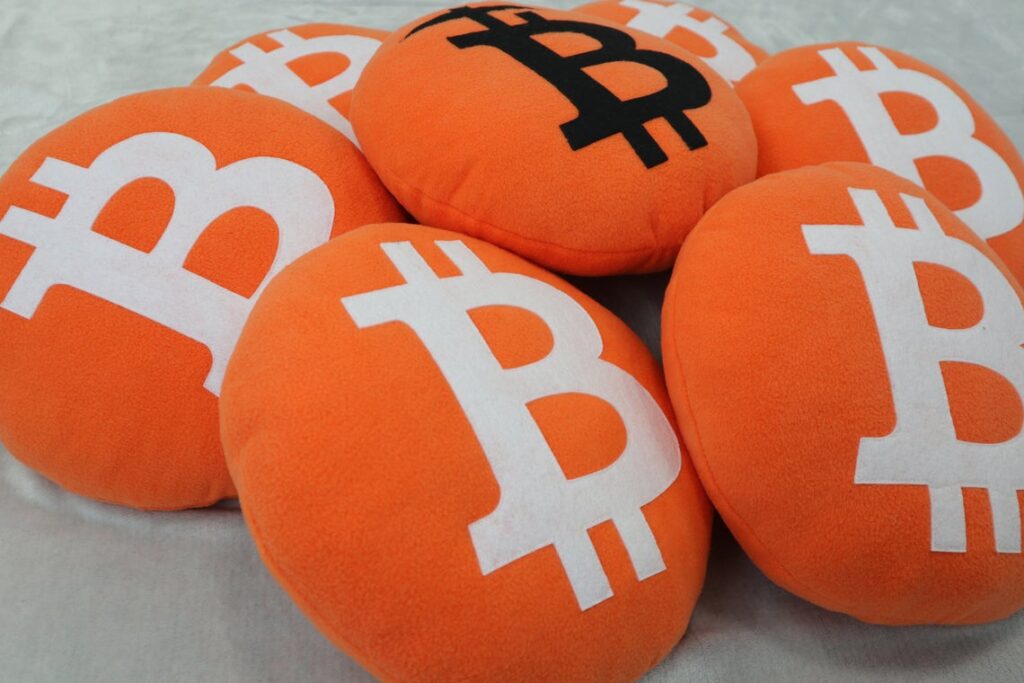 Pile of orange Bitcoin cushions