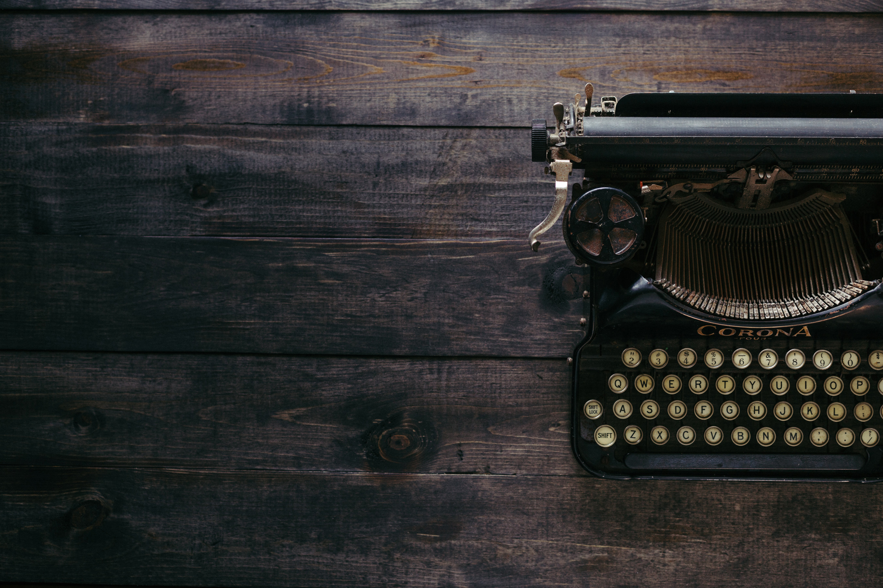 vintage typewriter on a wooden desk